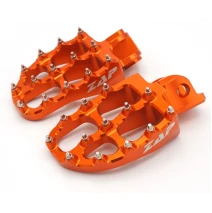 Stupačky pasují na KTM 690,HQ701,GAS 700 oranž